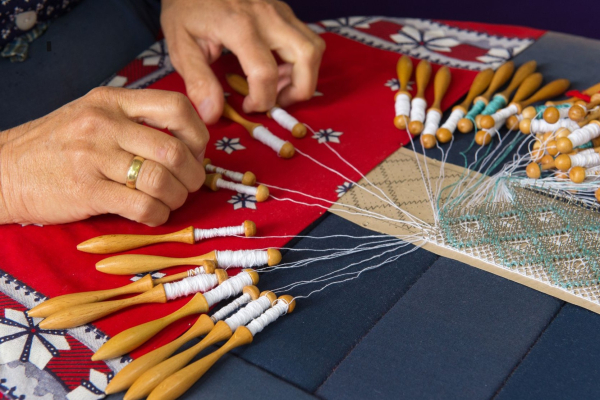 Image of someone bobbin lace making