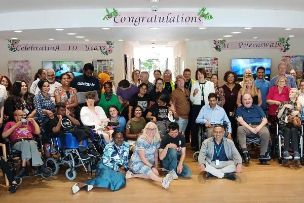 Centre users, their families, and staff past and present celebrate the 10th anniversary of the Queens Walk Resource Centre