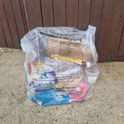 Clear recycling bag containing dry mixed recycling