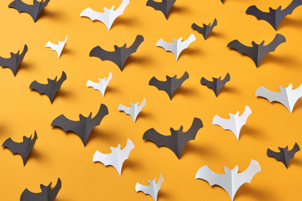 Paper bats on an orange background