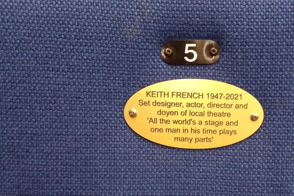 Photo of a theatre seat plaque dedicated to Keith French (1947-2021)