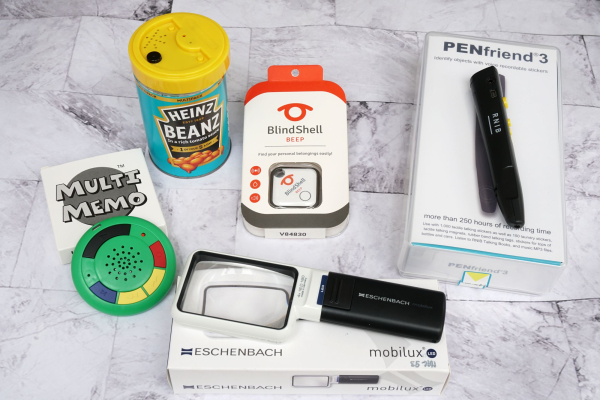 Photo of accessibility equipment items available at some of our libraries for people who are blind and partially sighted. Items include talking tin, pen friend, blindshell beep and multi memo recording device.