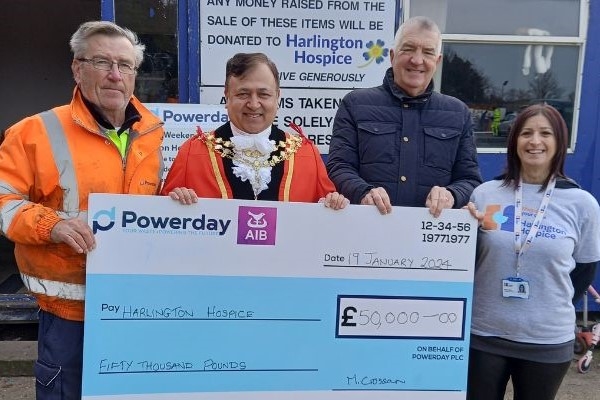 Cllr Eddie Lavery and the Mayor of Hillingdon holding a giant cheque for £50,000 standing alongside representatives from Powerday - who run the council's waste facility in West Drayton - and Hillingdon Hospice.
