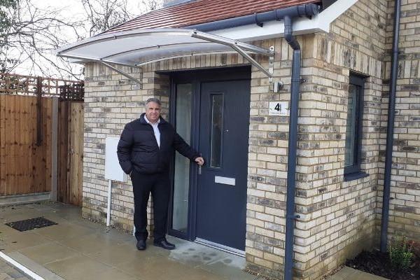 Cllr Steve Tuckwell outside one of the new council homes in Harefield