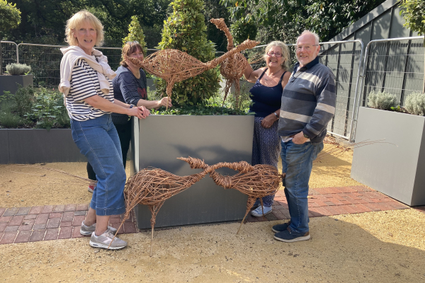 Image of people with their weaven birds