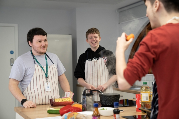group of boys cooking