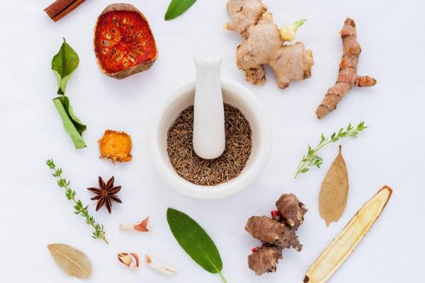 Photo of herbs and spices on a clear surface