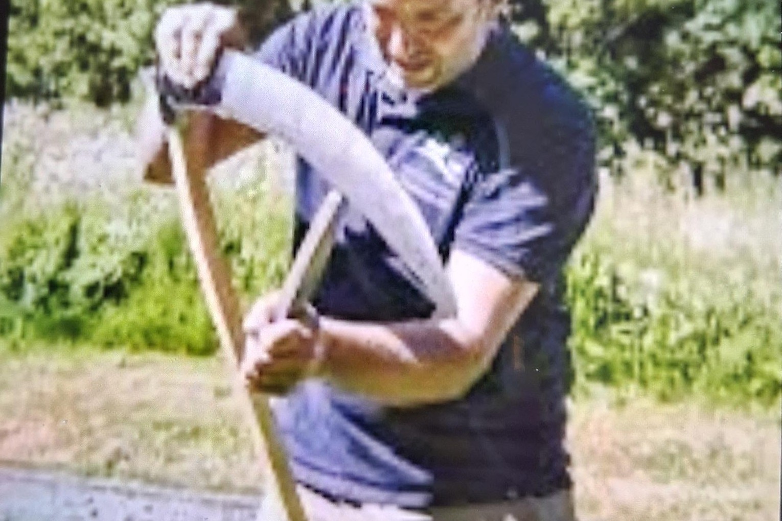 Person using a scythe