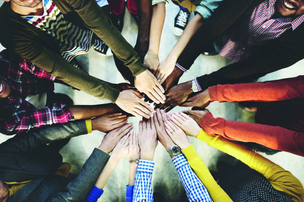 Circle of hands joining together