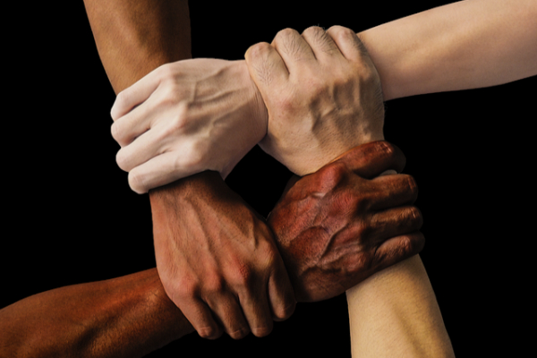 Hands coming together in unity